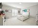 A cozy bedroom with a comfortable bed, white carpet, and natural light from the window at 3423 Jamont Blvd, Alpharetta, GA 30022