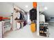 Custom walk-in closet with ample storage, shelving, and multiple hanging rods for organization at 3423 Jamont Blvd, Alpharetta, GA 30022