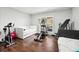 A well-equipped exercise room with a variety of equipment and a comfortable seating area at 3423 Jamont Blvd, Alpharetta, GA 30022