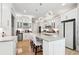 Bright kitchen featuring a large island, granite countertops, and modern white cabinetry at 3423 Jamont Blvd, Alpharetta, GA 30022