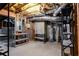 Unfinished basement features utility area, shelving, and concrete walls and floors at 4045 Hillcrest View Ct, Suwanee, GA 30024