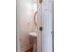 Powder room featuring a pedestal sink and oval mirror at 4045 Hillcrest View Ct, Suwanee, GA 30024