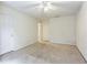 Neutral bedroom featuring carpet flooring and multiple entrances and exits at 4045 Hillcrest View Ct, Suwanee, GA 30024