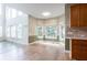Bright dining area with large windows and a connection to the kitchen at 4045 Hillcrest View Ct, Suwanee, GA 30024
