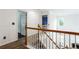 Hallway with natural-light, hardwood floors and access to rooms with white doors at 4045 Hillcrest View Ct, Suwanee, GA 30024