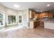 Bright kitchen with wood cabinets, stainless steel appliances, and an adjoining eating area at 4045 Hillcrest View Ct, Suwanee, GA 30024