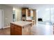 An open-concept kitchen with a center island and seamless connection to the living area at 4045 Hillcrest View Ct, Suwanee, GA 30024