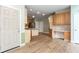 Open kitchen featuring wood cabinets and stainless steel appliances, connecting to dining area at 4045 Hillcrest View Ct, Suwanee, GA 30024