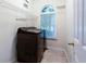 Bright laundry room with modern washer and dryer, wire shelving, and natural light from the window at 4045 Hillcrest View Ct, Suwanee, GA 30024