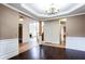 Inviting living area with decorative moldings and view to living room with fireplace at 4045 Hillcrest View Ct, Suwanee, GA 30024