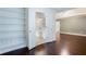 Spacious main bedroom with hardwood floors leading to a bathroom at 4045 Hillcrest View Ct, Suwanee, GA 30024