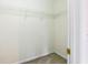 Bright walk-in closet features white walls, neutral carpeting, and wire shelving for optimal storage space at 4045 Hillcrest View Ct, Suwanee, GA 30024