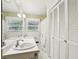 Well-lit bathroom with double sinks and a large linen closet at 415 Haven Ln, Marietta, GA 30066
