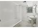 Bathroom features a tub, tile floors, and modern fixtures at 415 Haven Ln, Marietta, GA 30066