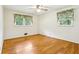 Sunny bedroom with hardwood floors and decorative floral window treatments at 415 Haven Ln, Marietta, GA 30066