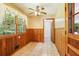 Bright breakfast nook featuring lots of windows, wood paneling, and a ceiling fan at 415 Haven Ln, Marietta, GA 30066
