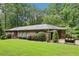 Spacious one-story home with landscaped front yard, arbor covered walkway, and private parking at 415 Haven Ln, Marietta, GA 30066