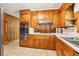 Updated kitchen featuring wood cabinets, stainless steel appliances, and a tile floor at 415 Haven Ln, Marietta, GA 30066