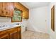 Functional laundry room with tile flooring and built-in cabinets at 415 Haven Ln, Marietta, GA 30066