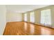 Spacious living room with hardwood floors and three large windows at 415 Haven Ln, Marietta, GA 30066