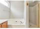 A well-lit full bathroom featuring a bathtub, shower, and modern fixtures at 4284 Cabretta Se Dr, Smyrna, GA 30080