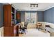 Inviting home office with custom built-ins, natural light, and neutral carpet at 4284 Cabretta Se Dr, Smyrna, GA 30080