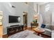 Living room featuring high ceilings, a fireplace, hardwood floors, and neutral-colored walls at 4284 Cabretta Se Dr, Smyrna, GA 30080