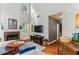 Bright living room features a fireplace, hardwood floors, and ample natural light at 4284 Cabretta Se Dr, Smyrna, GA 30080