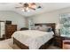 Comfortable main bedroom with a large window, ceiling fan, and nice furniture at 4284 Cabretta Se Dr, Smyrna, GA 30080
