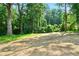 A vacant lot with trees provides a private backdrop for the new home at 124 Sims Dr, Hiram, GA 30141
