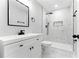 Modern bathroom with sleek fixtures, walk-in shower, black trim, and marble tiled floor at 124 Sims Dr, Hiram, GA 30141