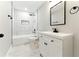 Bathroom featuring stylish vanity with sink, mirror, tiled shower and flooring, and modern fixtures at 124 Sims Dr, Hiram, GA 30141