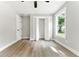 Bedroom with hardwood floors, closet, window, and bi-fold doors at 124 Sims Dr, Hiram, GA 30141