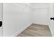 Walk-in closet with wood floor and wire shelving, ready for organizing your wardrobe at 124 Sims Dr, Hiram, GA 30141