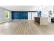 Spacious living room and kitchen combo, with modern luxury vinyl flooring and accent wall at 124 Sims Dr, Hiram, GA 30141