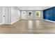 Bright open living room with natural light, luxury vinyl flooring, and freshly painted walls at 124 Sims Dr, Hiram, GA 30141