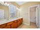 Bathroom featuring a double sink vanity, large mirror, and tub/shower combo providing function and design at 189 Privet Cir, Suwanee, GA 30024
