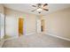 Bedroom with multiple rooms, carpeted floors, and windows that create an open and welcoming space at 189 Privet Cir, Suwanee, GA 30024