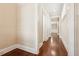 A bright hallway with hardwood floors, white trim, and natural light streaming in at 189 Privet Cir, Suwanee, GA 30024