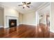 A living room with a fireplace and wood floors at 189 Privet Cir, Suwanee, GA 30024