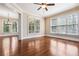 A living room with bright windows and hardwood floors at 189 Privet Cir, Suwanee, GA 30024