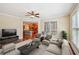 A living room with furniture and a TV is visible through the entryway to the kitchen at 189 Privet Cir, Suwanee, GA 30024