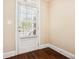 Mud room with a white door and window with wood floor at 189 Privet Cir, Suwanee, GA 30024