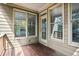 Outdoor patio featuring wood floors with a view to the lush green trees at 189 Privet Cir, Suwanee, GA 30024