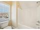 Efficient bathroom design featuring a toilet and shower near a bright window for functionality at 189 Privet Cir, Suwanee, GA 30024