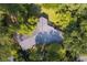 Aerial view of home showing a large roof and lush greenery providing privacy and shade at 2349 Echo Cliff Ne Ct, Atlanta, GA 30345
