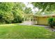 Large backyard featuring lush lawn and a cozy screened-in porch perfect for outdoor enjoyment and relaxation at 2349 Echo Cliff Ne Ct, Atlanta, GA 30345