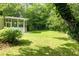 A beautifully landscaped backyard featuring a screened-in porch and vibrant hydrangea bushes at 2349 Echo Cliff Ne Ct, Atlanta, GA 30345