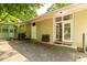 Backyard view featuring double doors and an adjacent screen porch with an air conditioning unit at 2349 Echo Cliff Ne Ct, Atlanta, GA 30345