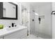 Modern bathroom features quartz counters, modern fixtures, a glass enclosed shower, and stylish finishes at 2349 Echo Cliff Ne Ct, Atlanta, GA 30345